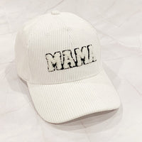 Corduroy Mama Baseball Cap-Adorable corduroy MAMA ball cap with fuzzy patch lettering. Has great fit with perfect curved brim. Clip closure on the back to adjust size and hidden pocket.