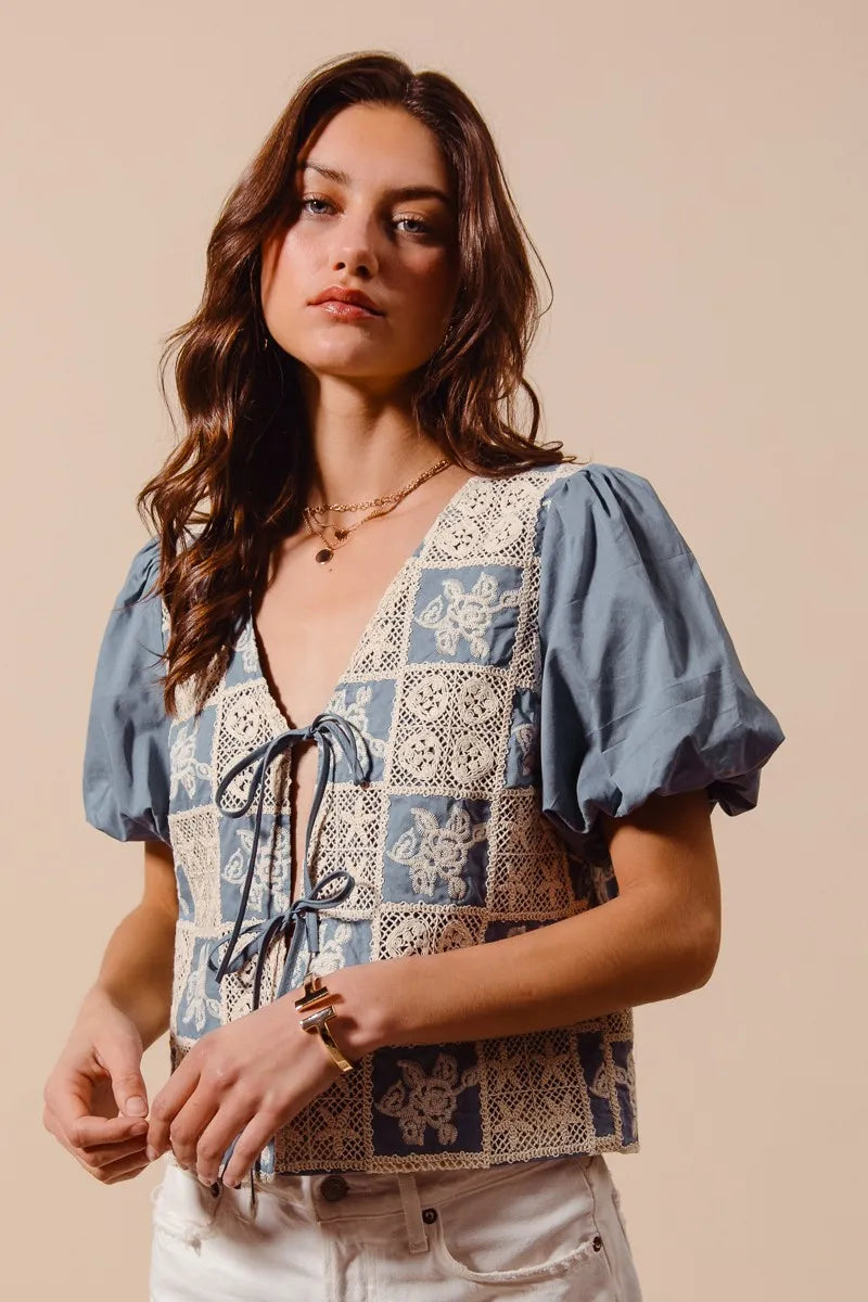 Shop Crochet Lace Tie Front V Neck Blouse-Boho-chic lace tie front blouse with vintage patchwork print & puff sleeves. Lightweight & airy, perfect for summer outings & coastal-inspired looks.-available at Reef Love online boho-chic boutique