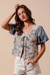Shop Crochet Lace Tie Front V Neck Blouse-Boho-chic lace tie front blouse with vintage patchwork print & puff sleeves. Lightweight & airy, perfect for summer outings & coastal-inspired looks.-available at Reef Love online boho-chic boutique