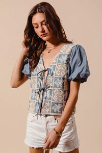 Shop Crochet Lace Tie Front V Neck Blouse-Boho-chic lace tie front blouse with vintage patchwork print & puff sleeves. Lightweight & airy, perfect for summer outings & coastal-inspired looks.-available at Reef Love online boho-chic boutique