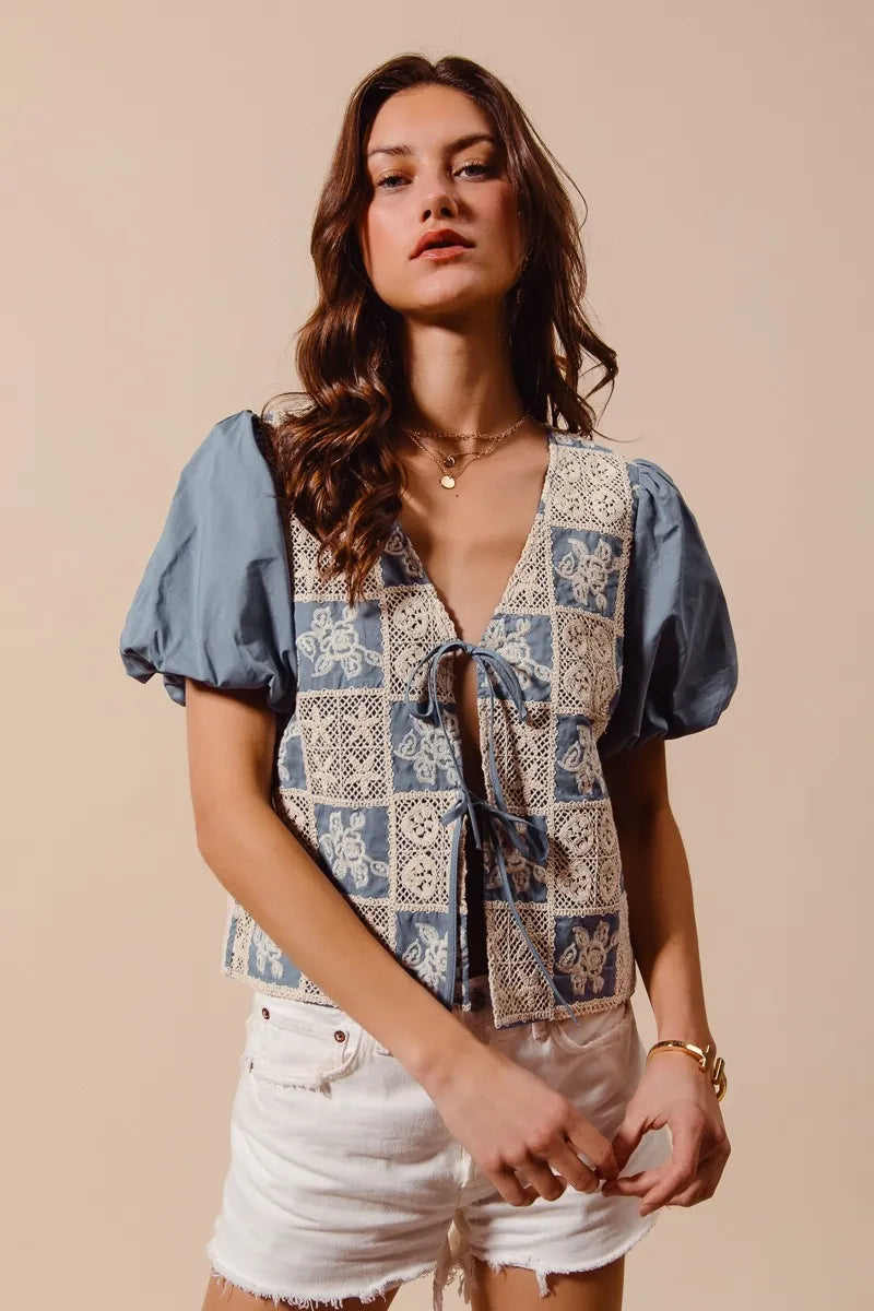 Shop Crochet Lace Tie Front V Neck Blouse-Boho-chic lace tie front blouse with vintage patchwork print & puff sleeves. Lightweight & airy, perfect for summer outings & coastal-inspired looks.-available at Reef Love online boho-chic boutique