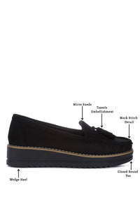 Daiki platform lug sole tassel loafers in soft micro suede with cushioned insole. A chic, edgy update to classic loafers