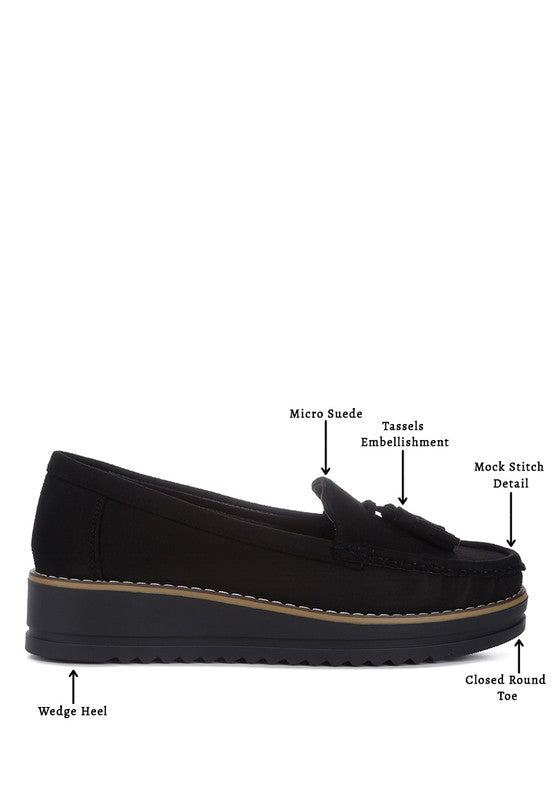 Daiki platform lug sole tassel loafers in soft micro suede with cushioned insole. A chic, edgy update to classic loafers