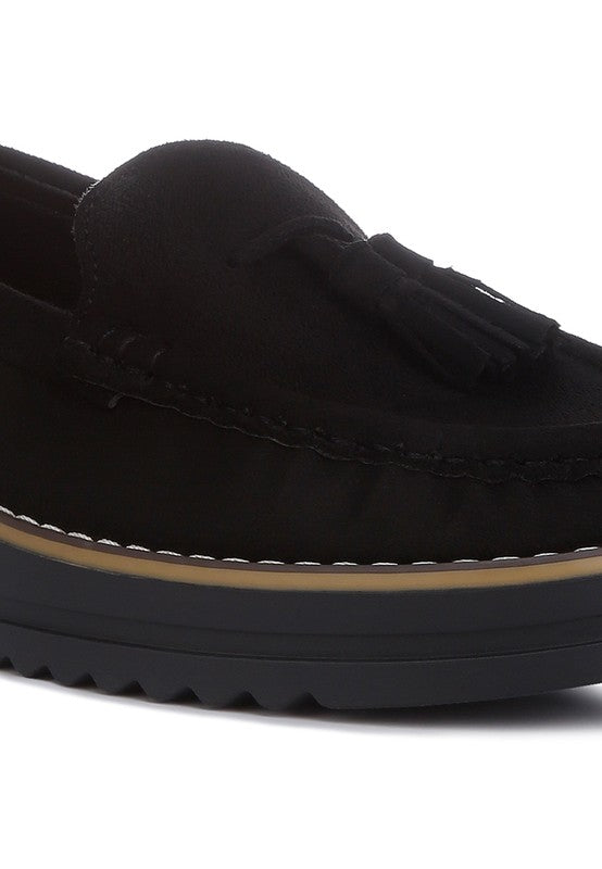 Daiki platform lug sole tassel loafers in soft micro suede with cushioned insole. A chic, edgy update to classic loafers.