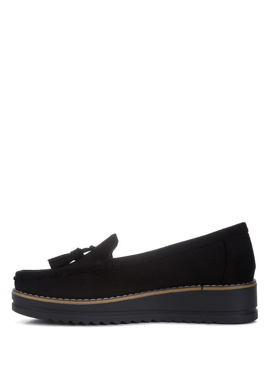 Daiki platform lug sole tassel loafers in soft micro suede with cushioned insole. A chic, edgy update to classic loafers