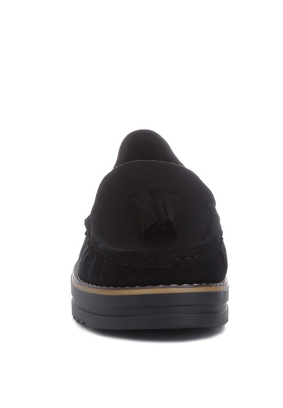 Daiki platform lug sole tassel loafers in soft micro suede with cushioned insole. A chic, edgy update to classic loafers