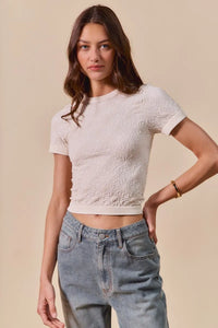 Shop Floral Patterned Seamless T-Shirt-A floral patterned seamless short sleeve top is a stylish and comfortable piece of clothing that combines a classic floral design with the seamless construction-available at Reef Love online boho-chic boutique