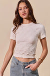 Shop Floral Patterned Seamless T-Shirt-A floral patterned seamless short sleeve top is a stylish and comfortable piece of clothing that combines a classic floral design with the seamless construction-available at Reef Love online boho-chic boutique