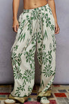 Floral Printed Woven Wide Leg Drawstring Pants-Green and Beige Floral Printed Woven Wide Leg Drawstring Pants. The Wide Leg Drawstring Pants are a chic and stylish choice for any fashion-forward individual. 