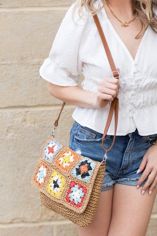 Crochet Woven Crossbody with flower accent. 