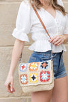 Crochet Woven Crossbody with flower accent. 