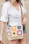 Crochet Woven Crossbody with flower accent. 