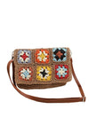 Crochet Woven Crossbody with flower accent. 