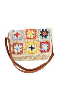 Crochet Woven Crossbody with flower accent. 