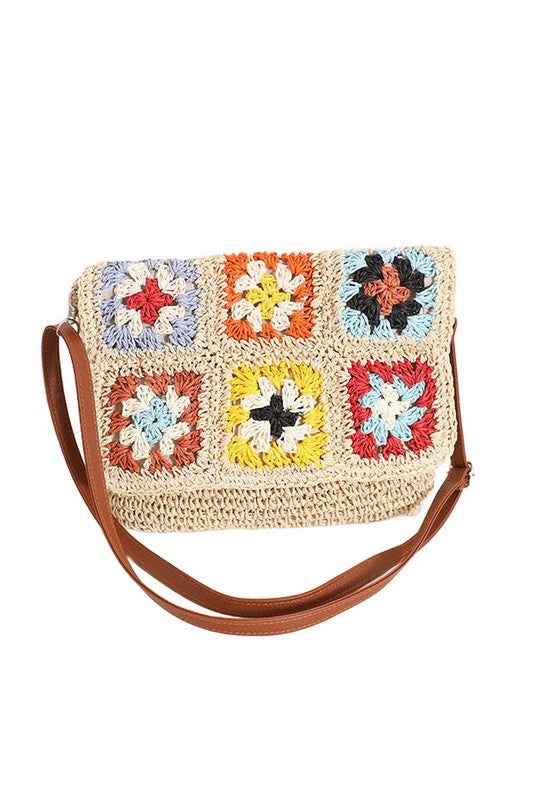 Crochet Woven Crossbody with flower accent. 