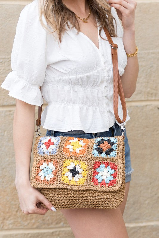 Foldover Crochet Woven Crossbody with flower accent. 