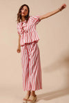 Shop Front Tie Stripe Top and Wide Leg Pants Set-Pink & white striped two-piece set with tie-front blouse & wide-leg pants. Lightweight & breezy for summer days, perfect for effortless feminine style.-available at Reef Love online boho-chic boutique