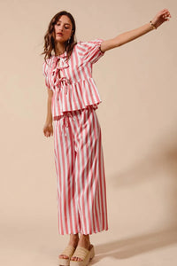 Shop Front Tie Stripe Top and Wide Leg Pants Set-Pink & white striped two-piece set with tie-front blouse & wide-leg pants. Lightweight & breezy for summer days, perfect for effortless feminine style.-available at Reef Love online boho-chic boutique