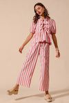 Shop Front Tie Stripe Top and Wide Leg Pants Set-Pink & white striped two-piece set with tie-front blouse & wide-leg pants. Lightweight & breezy for summer days, perfect for effortless feminine style.-available at Reef Love online boho-chic boutique
