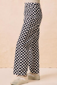 Gameday Theme Black & White Checkered Print Pants-Black & white checkered gameday pants. Relaxed straight-leg fit in breathable cotton. Fun, sporty style perfect for gameday outfits or casual streetwear.