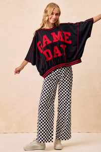 Gameday Theme Black & White Checkered Print Pants-Black & white checkered gameday pants. 