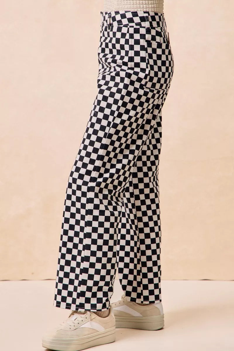Gameday Theme Black & White Checkered Print Pants-Black & white checkered gameday pants. Relaxed straight-leg fit in breathable cotton. Fun, sporty style perfect for gameday outfits or casual streetwear.