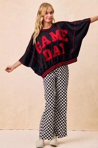 Black & white checkered women's pants. Fun, sporty style perfect for gameday outfits or casual streetwear.