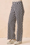 Gameday Theme Black & White Checkered Print Pants-Black & white checkered gameday pants. Relaxed straight-leg fit in breathable cotton. Fun, sporty style perfect for gameday outfits or casual streetwear.