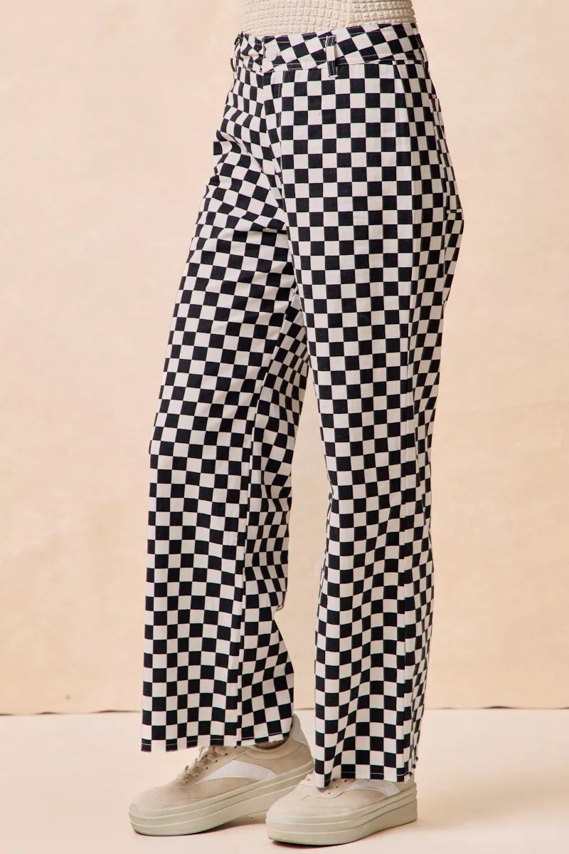 Gameday Theme Black & White Checkered Print Pants-Black & white checkered gameday pants. Relaxed straight-leg fit in breathable cotton. Fun, sporty style perfect for gameday outfits or casual streetwear.