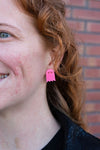 Shop Ghost Studs - Pink Glitter-Pink glitter ghost stud earrings with hypoallergenic posts. Light, sparkly, and spooky-cute—perfect for Halloween or showing off your playful ghost-loving side.-available at Reef Love online boho-chic boutique