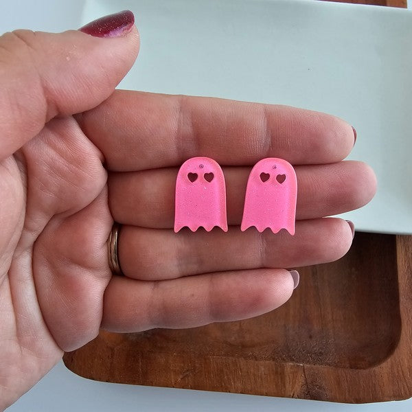 Shop Ghost Studs - Pink Glitter-Pink glitter ghost stud earrings with hypoallergenic posts. Light, sparkly, and spooky-cute—perfect for Halloween or showing off your playful ghost-loving side.-available at Reef Love online boho-chic boutique