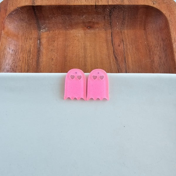 Shop Ghost Studs - Pink Glitter-Pink glitter ghost stud earrings with hypoallergenic posts. Light, sparkly, and spooky-cute—perfect for Halloween or showing off your playful ghost-loving side.-available at Reef Love online boho-chic boutique