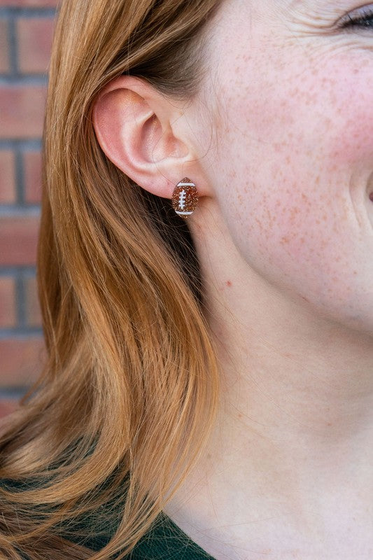 Shop Glitter Football Stud Earrings-Glitter football stud earrings with hypoallergenic posts. Lightweight, sparkly, and perfect for fans, tailgates, and showing your team spirit in style.-available at Reef Love online boho-chic boutique