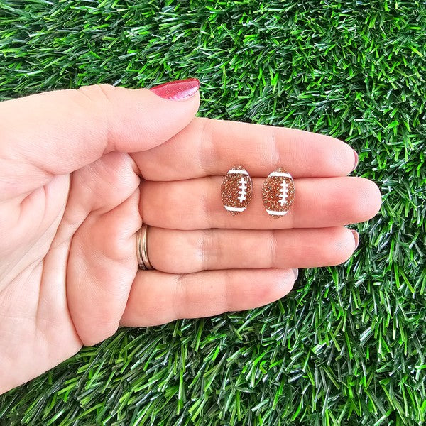 Shop Glitter Football Stud Earrings-Glitter football stud earrings with hypoallergenic posts. Lightweight, sparkly, and perfect for fans, tailgates, and showing your team spirit in style.-available at Reef Love online boho-chic boutique