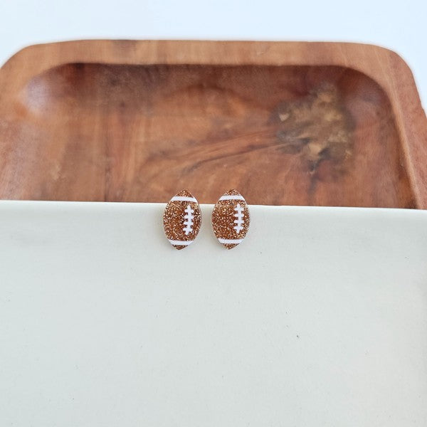Shop Glitter Football Stud Earrings-Glitter football stud earrings with hypoallergenic posts. Lightweight, sparkly, and perfect for fans, tailgates, and showing your team spirit in style.-available at Reef Love online boho-chic boutique