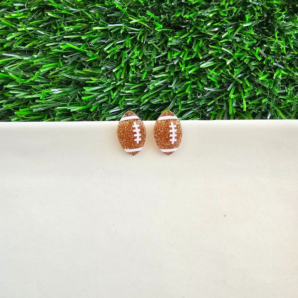 Shop Glitter Football Stud Earrings-Glitter football stud earrings with hypoallergenic posts. Lightweight, sparkly, and perfect for fans, tailgates, and showing your team spirit in style.-available at Reef Love online boho-chic boutique