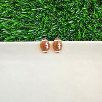 Shop Glitter Football Stud Earrings-Glitter football stud earrings with hypoallergenic posts. Lightweight, sparkly, and perfect for fans, tailgates, and showing your team spirit in style.-available at Reef Love online boho-chic boutique