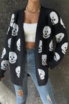 Shop Halloween Skull Print Knit Cardigan-Cozy, Bold & Spooky-Chic Add a bold, seasonal twist to your layers with the Halloween Skull Print Knit Cardigan — a must-have for spooky season lovers. -available at Reef Love online boho-chic boutique