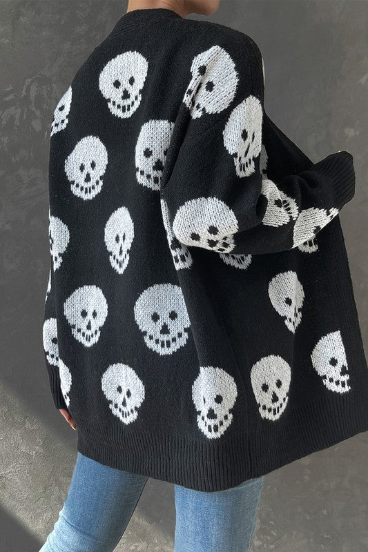 Shop Halloween Skull Print Knit Cardigan-Cozy, Bold & Spooky-Chic Add a bold, seasonal twist to your layers with the Halloween Skull Print Knit Cardigan — a must-have for spooky season lovers. -available at Reef Love online boho-chic boutique