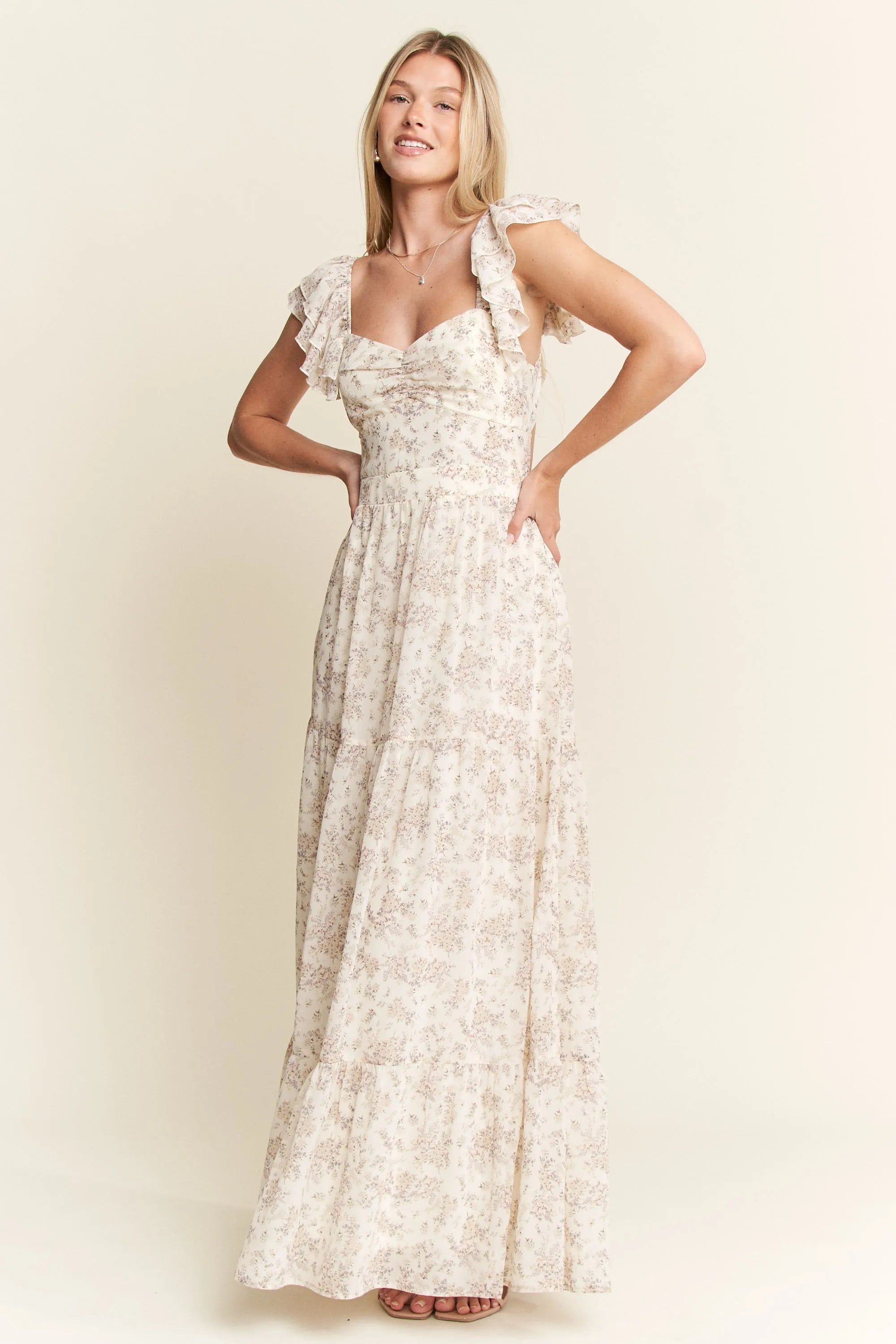 Ivory Ruffle Sleeve Tiered Maxi Dress-Effortlessly romantic and undeniably elegant, this tiered maxi dress is made for sun-drenched days and dreamy evenings. Featuring a delicate floral print-Reef Love Boho-Chic Boutique