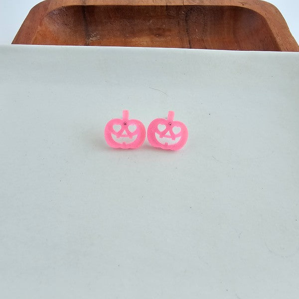 Shop Jack O Lantern Pumpkin Studs - Pink Glitter-Pink glitter jack o’ lantern earrings with hypoallergenic posts. Lightweight, festive, and fun—add a flirty twist to your Halloween or fall accessory lineup.-available at Reef Love online boho-chic boutique