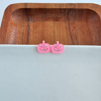 Shop Jack O Lantern Pumpkin Studs - Pink Glitter-Pink glitter jack o’ lantern earrings with hypoallergenic posts. Lightweight, festive, and fun—add a flirty twist to your Halloween or fall accessory lineup.-available at Reef Love online boho-chic boutique