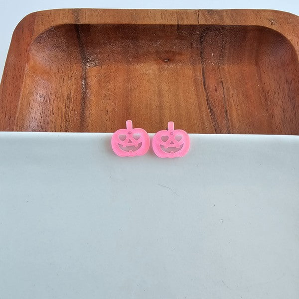 Shop Jack O Lantern Pumpkin Studs - Pink Glitter-Pink glitter jack o’ lantern earrings with hypoallergenic posts. Lightweight, festive, and fun—add a flirty twist to your Halloween or fall accessory lineup.-available at Reef Love online boho-chic boutique