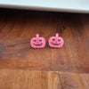 Shop Jack O Lantern Pumpkin Studs - Pink Glitter-Pink glitter jack o’ lantern earrings with hypoallergenic posts. Lightweight, festive, and fun—add a flirty twist to your Halloween or fall accessory lineup.-available at Reef Love online boho-chic boutique