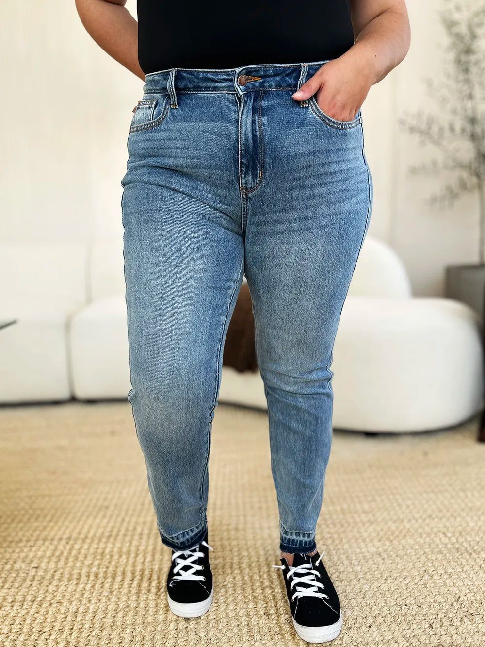 Judy Blue Mid Rise Rigid Magic Release Hem Jeans-Judy Blue Mid Rise Rigid Magic Release Hem Jeans with structured fit + stretch comfort. Trendy release hem. Available in standard & plus sizes.