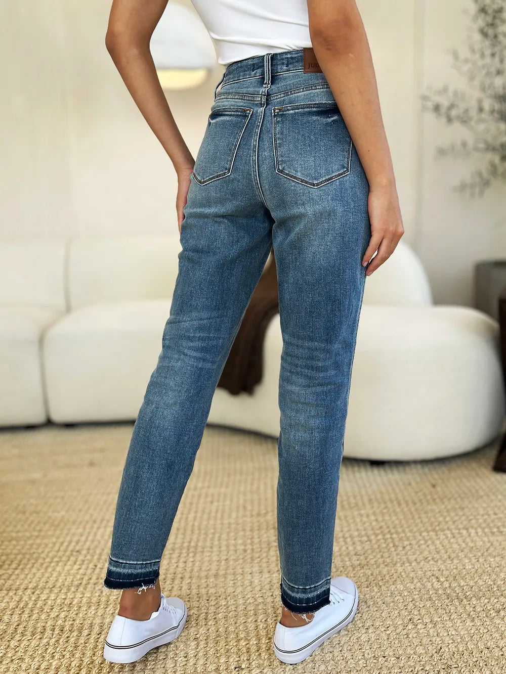 Judy Blue Mid Rise Rigid Magic Release Hem Jeans-Judy Blue Mid Rise Rigid Magic Release Hem Jeans with structured fit + stretch comfort. Trendy release hem. Available in standard & plus sizes.