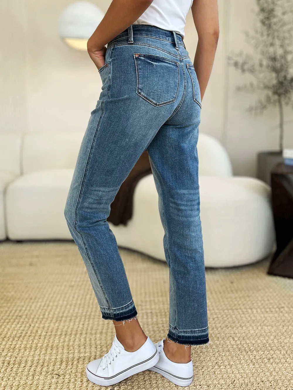 Judy Blue Mid Rise Rigid Magic Release Hem Jeans-Judy Blue Mid Rise Rigid Magic Release Hem Jeans with structured fit + stretch comfort. Trendy release hem. Available in standard & plus sizes.