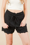Women's black Lace contrast woven shorts are chic and stylish bottoms that feature delicate lace accents. These shorts combine a woven fabric with lace detailing.
