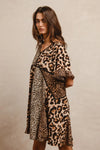 Leopard Print Mix and Match Mini Dress-Leopard Print Mix & Match Mini Dress, featuring a mix of leopard prints in rich, earthy tones. Designed with a V-neckline, flutter sleeves, and an empire waist.-Reef Love Boho-Chic Boutique