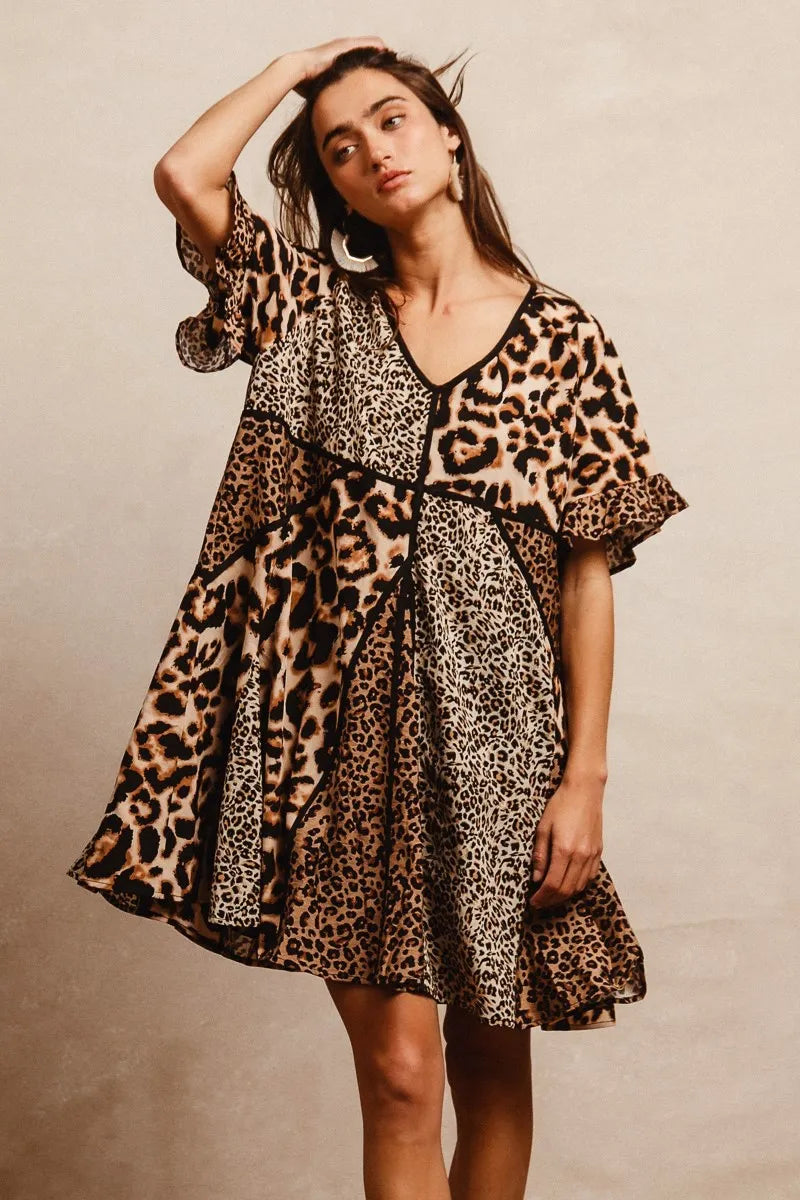 Leopard Print Mix and Match Mini Dress-Leopard Print Mix & Match Mini Dress, featuring a mix of leopard prints in rich, earthy tones. Designed with a V-neckline, flutter sleeves, and an empire waist.-Reef Love Boho-Chic Boutique